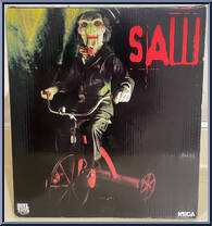 Billy the Puppet (Tricycle) (Push Button Sound)-2013 from Saw - 12" Scale manufactured by Neca [Back]